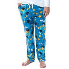 These are OFFICIALLY LICENSED Cookie Monster lounge pants! OM NOM NOM!! Cookie Monster is one of the most popular characters from the classic children's television show Sesame Street! The way he devours those Cookies, though... SAVAGE!! Remind you of anyone in your life? Or are you just a huge Cookie Monster fan? then these are the pajama pants to buy! These Sesame Street adult lounge pants are extremely high-quality with a new fabric blend style. It is made of a wonderful 92% polyester / 8% spa Pjamamas Pants, Elmo Pajama Pants, Cartoon Pajama Pants, Pants To Buy, Pjs Aesthetic, Cookie Monster Onesie, Mens Pyjama Bottoms, Cotton Pajama Pants, Popular Characters