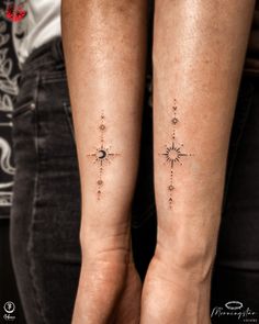 two people with matching tattoos on their legs, one has a cross and the other has a star