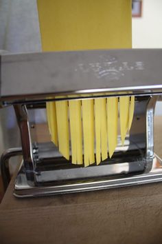 the pasta is being made in a machine