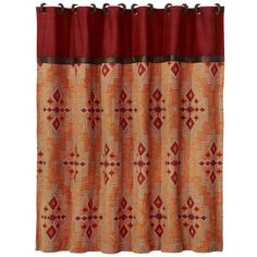 an orange and red curtain hanging on the side of a window with black grommets