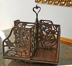 an ornate metal book holder on a table