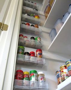 an organized pantry with canned food and cans