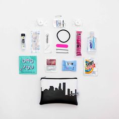 the contents of a travel kit laid out on a white surface, including toiletries and other items