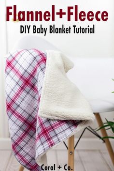 a blanket sitting on top of a white chair next to a potted green plant