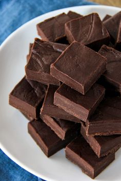 a white plate topped with pieces of chocolate