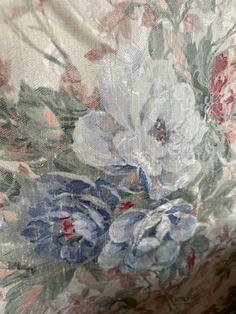 the fabric is covered with flowers and leaves