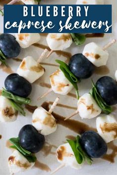 blueberry caprese skewers on a white plate