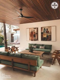 a living room filled with furniture next to a swimming pool