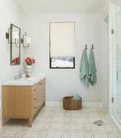 a bathroom with two towels hanging on the wall