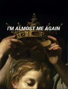 a man holding a crown over his head with the caption i'm almost me again