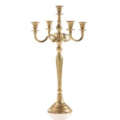 a golden candelabra with five candles on it's sides and one candle in the middle