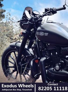 a black motorcycle parked on the side of a road