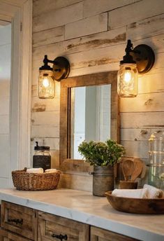 a bathroom vanity with two lights and a basket on the counter top next to it