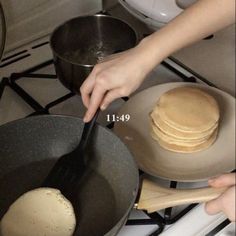 pancakes being cooked in a pan on the stove