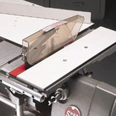 a close up of a metal object on a conveyor belt