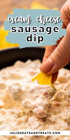 a hand dipping a tortilla chip into a bowl of cream cheese sausage dip