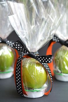 apples wrapped in cellophane and tied with ribbon