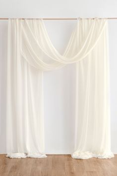 There's an arch for every wedding. These sheer draping fabric sets will help to create great eye-catching detail in your wedding decor. NOTE: Floral arrangements are not included! PACKAGE DETAILS: Package: Pack of 2 panels, each panel is 30" wide and 10.5 yards long. Material: 100% polyester. Wrinkle-Free Premium Material. It's a heavier-weight fabric that wasn't 100% opaque, it's more graceful, soft, and flowy than tulle, nylon, or organza ones to create romantic decor on your wedding day. Refe White Drapery Wedding Backdrop, White Drape Backdrop, Wedding Arch With Fabric, Simple Wedding Alter, Draped Arch, Draping Backdrop, Wall Draping, Wedding Arch Draping, Wedding Drapery