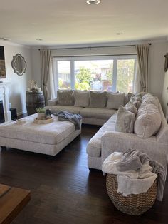 a living room filled with furniture and a fire place