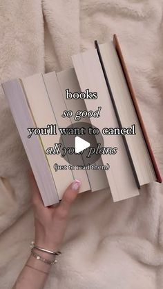 a person holding an open book on top of a white blanket with the words books so good you'll want to cameled all over plans