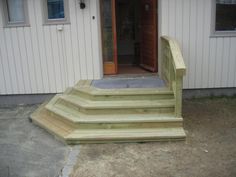 a house with steps leading up to the front door