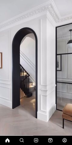 the interior of a house with white walls and black trim