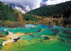 an aerial view of the colorfully colored water at pliturin park in japan