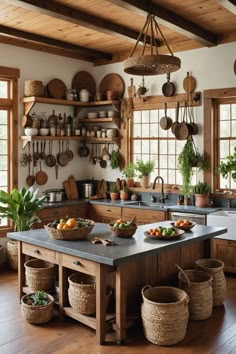 a kitchen with lots of pots and pans hanging from the ceiling above the island