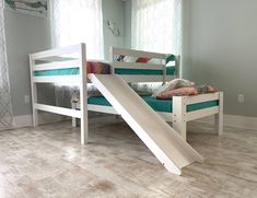 a child's bed with a slide in the middle