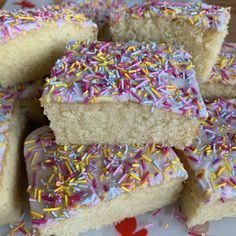 several pieces of cake with sprinkles on a plate