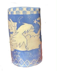 a blue and white vase with an angel on it