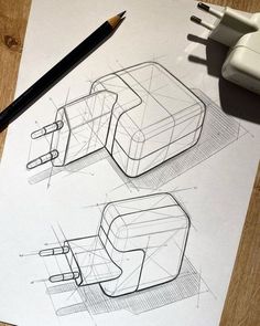 a drawing of some kind of device on top of a paper next to a pen