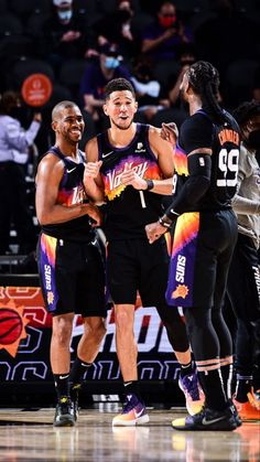 two basketball players are congratulating each other on the court