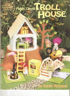 the front cover of a plastic canvas house