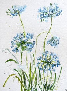 watercolor painting of blue flowers on white paper