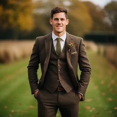 a man in a suit and tie posing for the camera