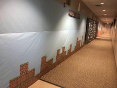 the hallway is decorated with an image of a video game on it's wall