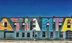 an old building has been painted with the word atlanta written in large letters on it