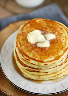 a stack of pancakes with butter on top