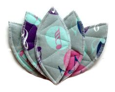 four pieces of fabric with musical notes on them