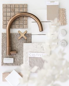 a sink faucet surrounded by tiles and other items