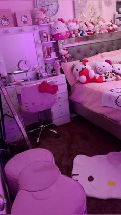 a bedroom with hello kitty decorations and pink furniture