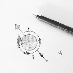 a drawing of an earth with arrows on it and a pen resting next to it