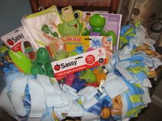 a pile of diapers and toys sitting on top of a chair