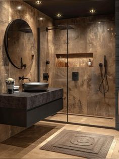 a bathroom with a sink, mirror and shower stall in it's center area