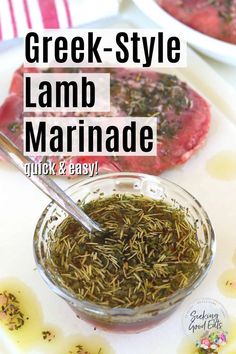 greek - style lamb marinade with herbs in a glass bowl on a white tray