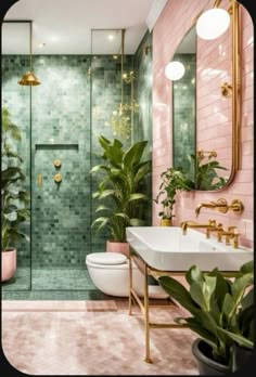 a bathroom with green tile and pink walls, gold fixtures and plants in the corner