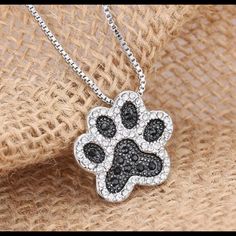 Restocked Boutique Item Beautiful Necklace With Stone Studded Paw Print Charm. The Necklace Measure Approximately 18” And The Paw Print Is Approximately 1” High By 1” Long This Beautiful Necklace And Charm Is Brand New And Is Set In A Kraft Brown Cardboard Gift Box. Proudly Display Your Love For Your Fur Baby With A Beautiful Paw Charm Displayed Close To Your Heart. All Follows, Shares, And Purchases Are Most Appreciated Dog Paw Pendant, Paw Pendant, Paw Print Pendant, Crystal Dog, Paw Print Necklace, Paw Pads, Dog Necklace, Silver Jewelry Fashion, White Rhinestone