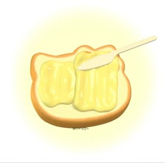 a piece of bread with butter on it and a spoon sticking out of the top