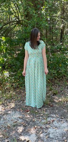 This beautiful mint floral maternity/nursing dress is the perfect dress to make you feel happy and bright this spring. It features a classic gathered skirt, making it maternity friendly. It is a classic dress that goes with every season. It's made of the softest brushed polyester to keep you comfortable while still remaining stylish. You will have easy breastfeeding access by simply lifting up the top layer. A second panel is underneath to keep it discreet as well.  Features: *Beautiful mint flo Modest Maternity Dress For Spring, Flowy Modest Maternity Maxi Dress, Modest Maternity Maxi Dress For Spring, Modest Maternity Summer Dress, Modest Green Flowy Maxi Dress, Modest Flowy Maternity Dress For Spring, Green Short Sleeve Maternity Dress For Summer, Spring Modest Flowy Maternity Dress, Modest Fitted Maternity Dress